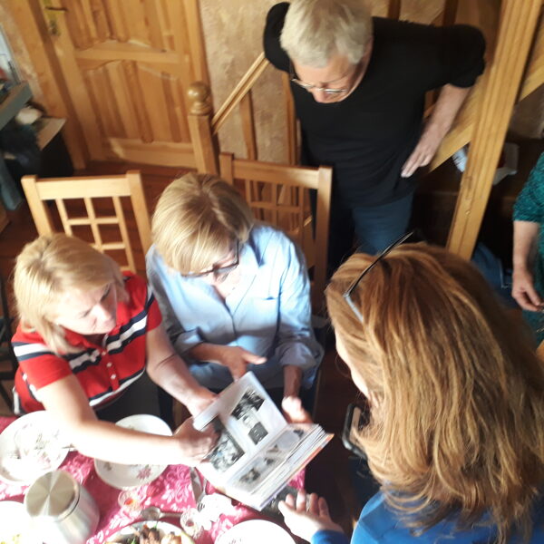 Looking at old family photos with newly found relatives