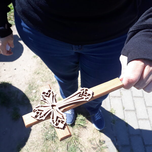 Leaving a cross at the Hill of Crosses