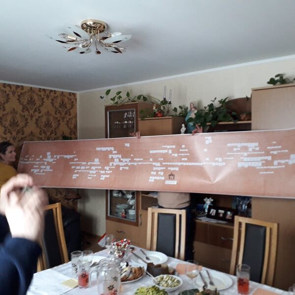 Studying the family tree at newly found cousins' home