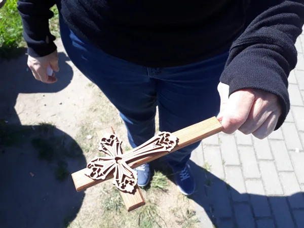 Leaving a cross at the Hill of Crosses