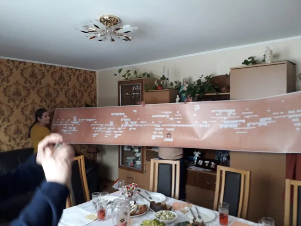 Studying the family tree at newly found cousins' home
